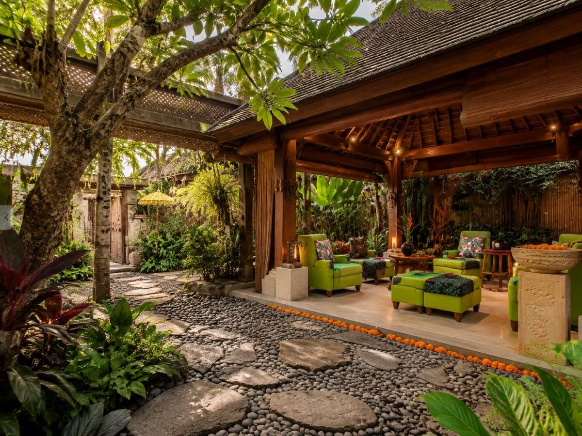 Ubud Padi Villas private pool and tropical garden courtyard with villa lounge area